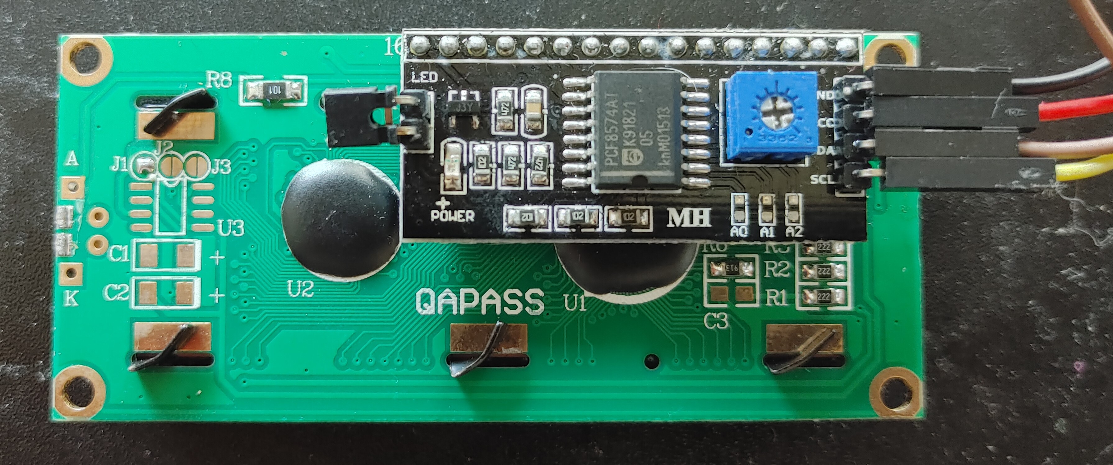 Picture of the I2C module soldered onto the back to the LCD module